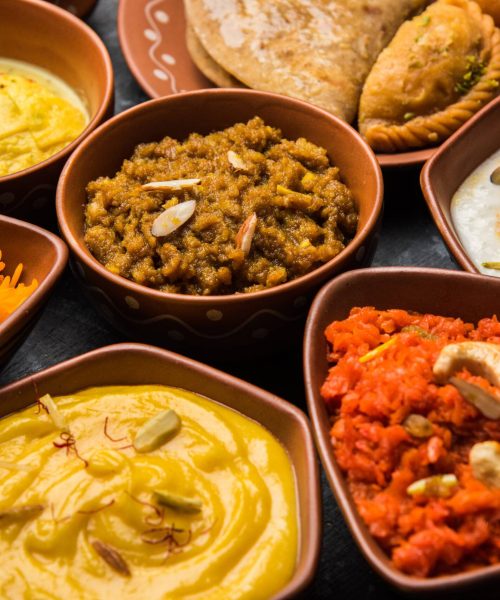 group of Indian Sweet or mithai in terracotta bowl, selective focus