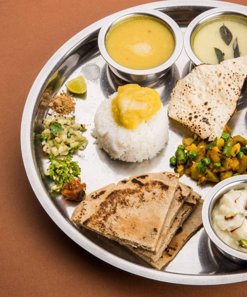 typical Healthy maharashtrian Food Platter or Thali full of nutrients, selective focus